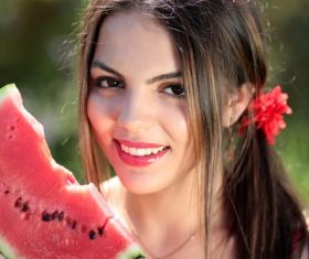 Stock Photo Beautiful girl holding watermelon in hand
