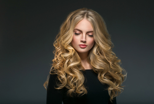 Stock Photo Beautiful girl with blond curly long hair 10