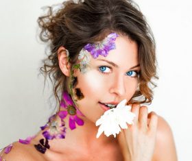 Stock Photo Beautiful woman decorated with petals