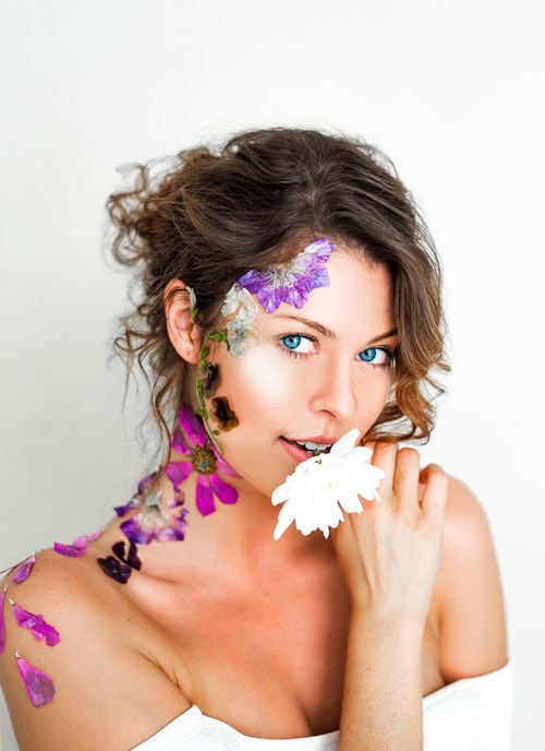 Stock Photo Beautiful woman decorated with petals