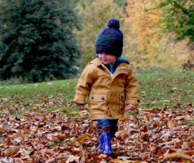 Stock Photo Children in warm outerwear are playing outdoors