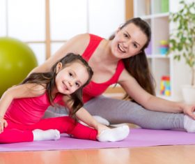 Stock Photo Children who exercise with their mother
