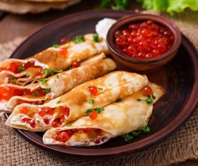 Stock Photo Delicious pancake with red caviar 18