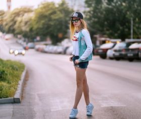 Stock Photo Fashion girl taking pictures on the street