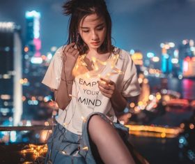 Stock Photo Girl holding decorative lights