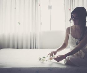 Stock Photo Girl playing with garland