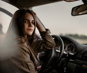 Stock Photo Girl sitting in the car