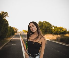 Stock Photo Girl taking pictures on the road pose