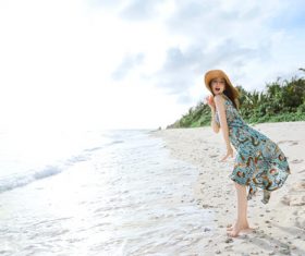 Stock Photo Live waves cute beautiful asian girl seaside posing
