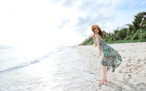 Stock Photo Live waves cute beautiful asian girl seaside posing