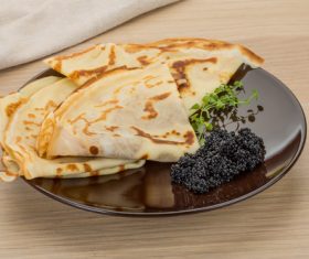 Stock Photo Pancake with black caviar 01