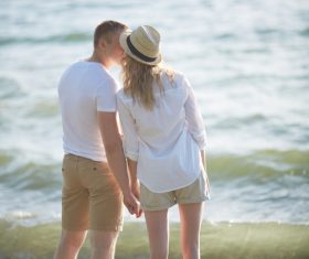 Stock Photo Standing on the beach very intimate Lovers