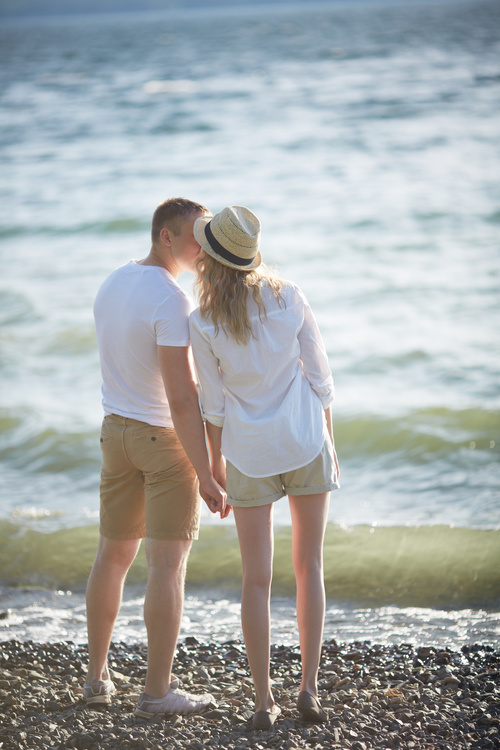 Stock Photo Standing on the beach very intimate Lovers