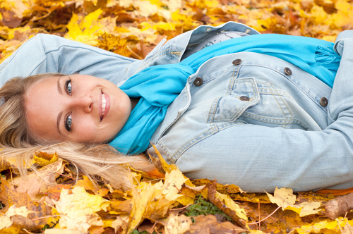 Stock Photo Woman lying on fallen leaves