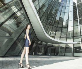 Stock Photo Woman standing in front of the building