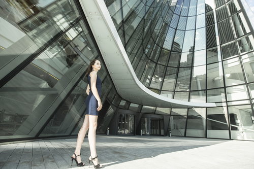 Stock Photo Woman standing in front of the building