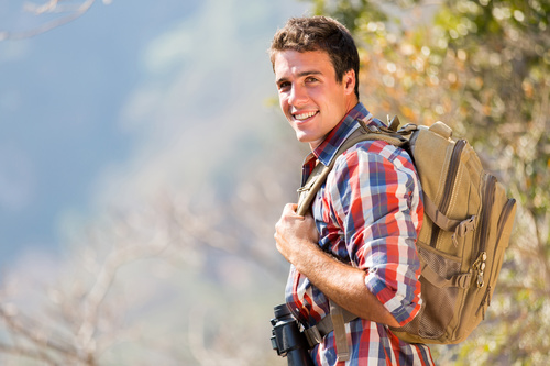 Stock Photo Young man travel on foot