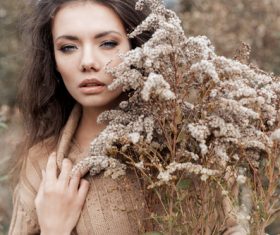 Woman and withered plants Stock Photo