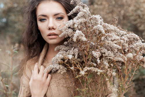Woman and withered plants Stock Photo
