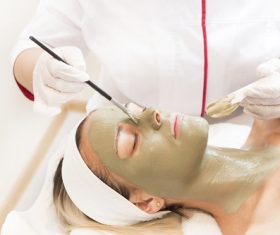 Woman doing skin care in beauty salon Stock Photo 01