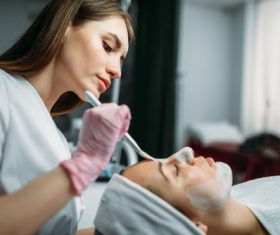 Woman doing skin care in beauty salon Stock Photo 02