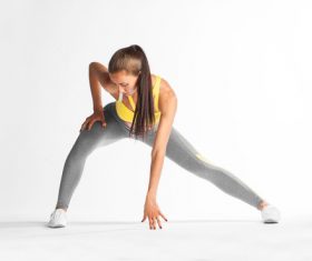 Woman wearing sportswear doing exercise Stock Photo