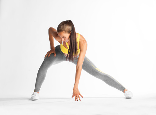 Woman wearing sportswear doing exercise Stock Photo