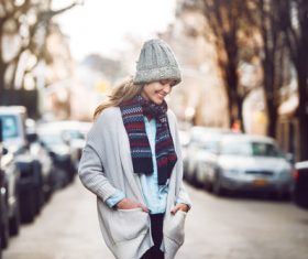 Woman wearing warm clothes on autumn street Stock Photo