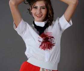 Woman with hands behind head Stock Photo