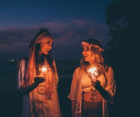 Women holding sparklers Stock Photo