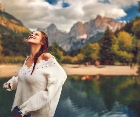 Young happy woman on the lake Stock Photo 02