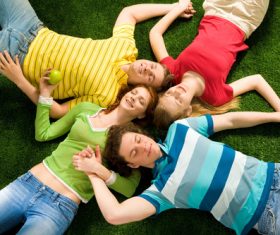 Young man lying on the grass Stock Photo 01