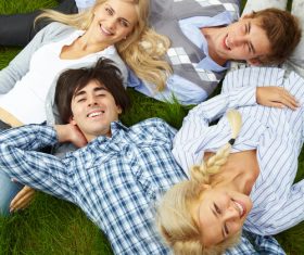 Young man lying on the grass Stock Photo 02