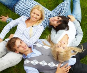 Young man lying on the grass Stock Photo 03