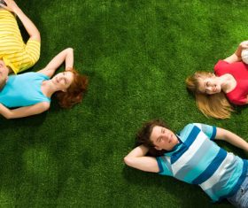 Young man lying on the grass Stock Photo 05
