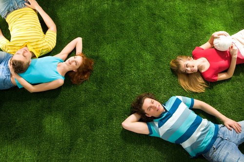 Young man lying on the grass Stock Photo 05