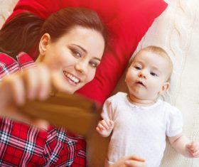 Young mother taking care of baby at home Stock Photo 04
