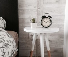 Alarm clock plant placed on the bedside Stock Photo