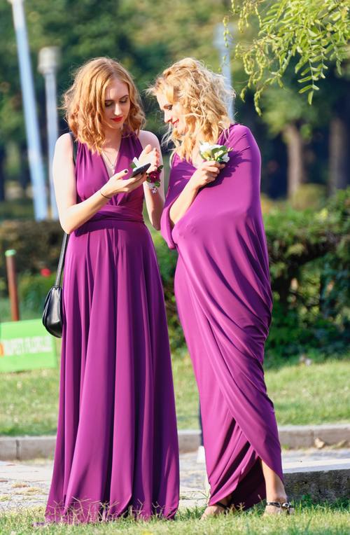 Bridesmaid wearing purple dress Stock Photo