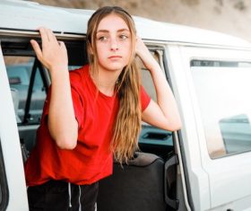 Girl standing in the car Stock Photo