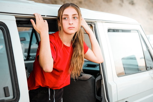 Girl standing in the car Stock Photo