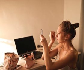 I am putting on make-up Stock Photo