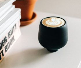 Lahua coffee with books on the desktop Stock Photo