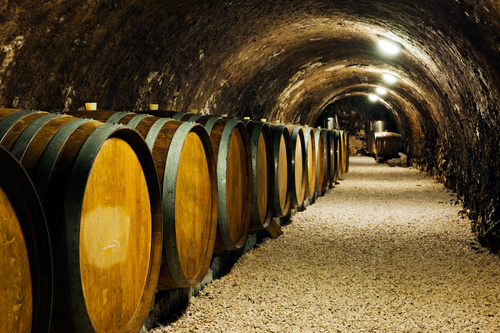 Large capacity wine barrels stored in the basement Stock Photo 04