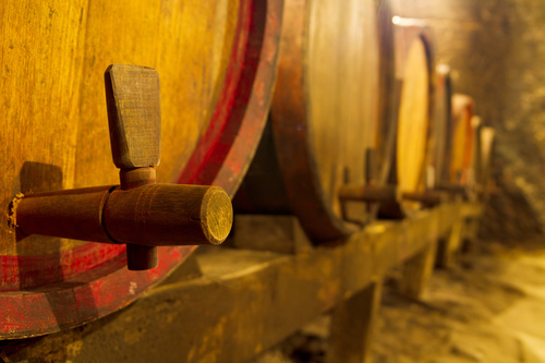 Large capacity wine barrels stored in the basement Stock Photo 06