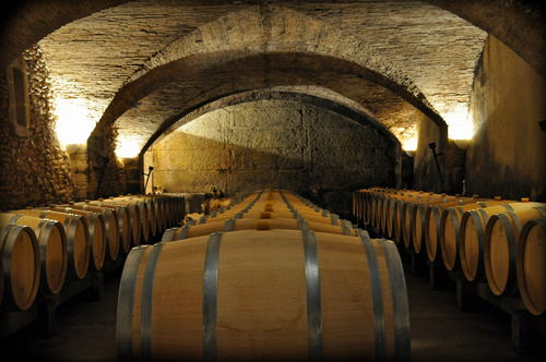 Large capacity wine barrels stored in the basement Stock Photo 10