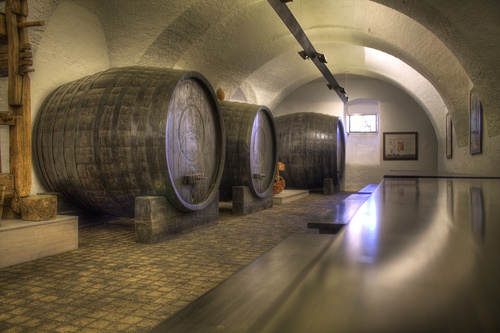 Large capacity wine barrels stored in the basement Stock Photo 11