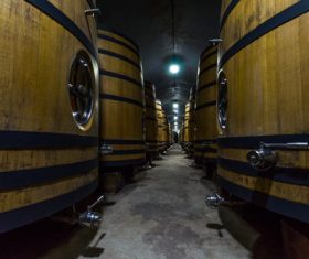 Large capacity wine barrels stored in the basement Stock Photo 12