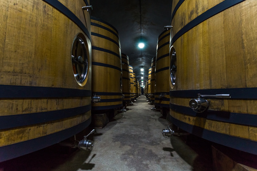 Large capacity wine barrels stored in the basement Stock Photo 12