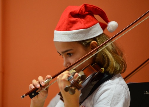 Little girl playing the violin Stock Photo